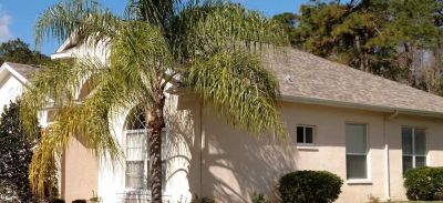 stucco home in central Florida with a new roof