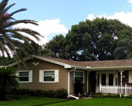 House with Brown Siding and White Shutters