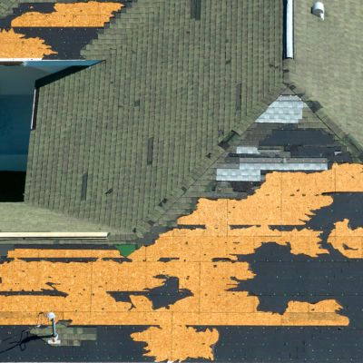 Rooftop with most of the shingles torn off from a hurricane